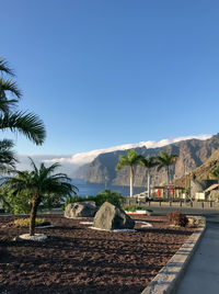 Scenic view of swimming pool against clear blue sky