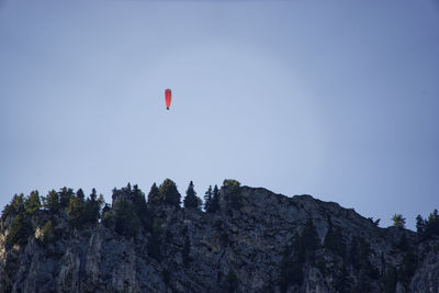 Low angle view of kite flying against clear sky