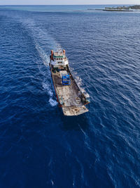 Aerial view of barge transporting single truck
