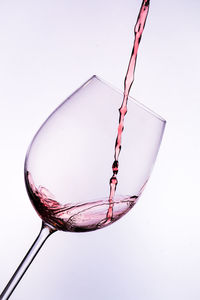 Close-up of wine against white background