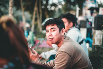 Portrait of young man outdoors