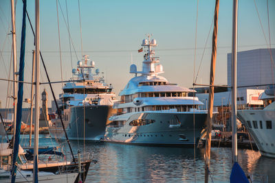 Cruise ships moored at harbor in city