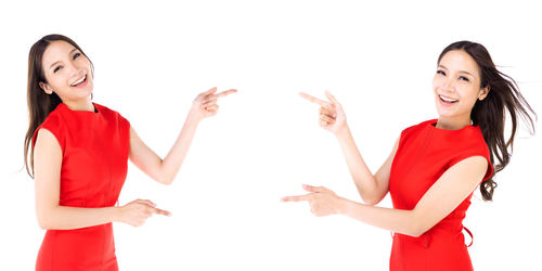 Portrait of a smiling young woman against white background