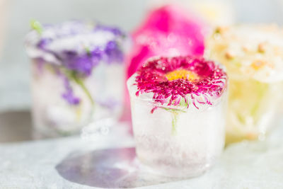 Close-up of pink rose on table