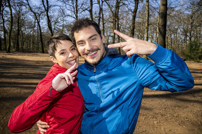 Couple is making a selfie in the woods.portrait of a beautiful smiling couple on a hike in the park.