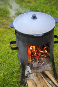 Cooking in a cauldron on the fire. picnic outdoors in summer.