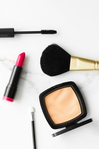 High angle view of beauty products against white background