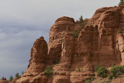 Low angle view of rock formation against sky