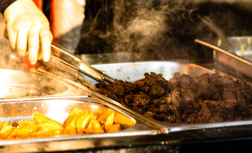 Close-up of person preparing food