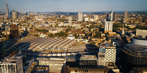 High angle view of modern buildings in city against sky