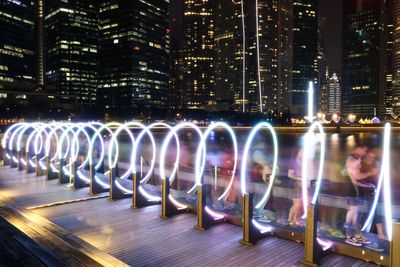 Illuminated buildings in city at night