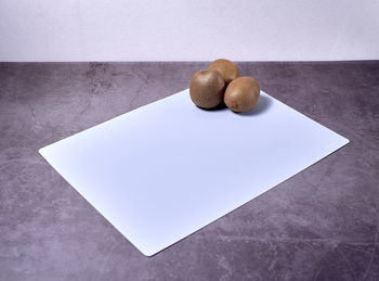 High angle view of bread on table against white background