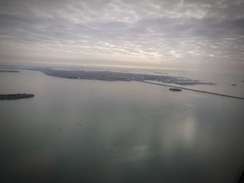 High angle view of sea against sky at sunset