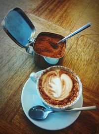 High angle view of cappuccino on table