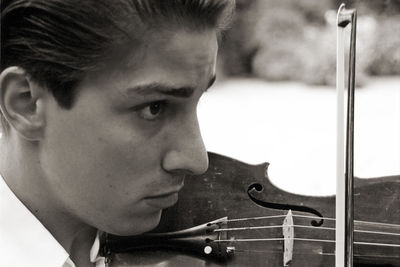 Close-up portrait of a serious young man