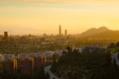 High angle view of city against sky during sunset