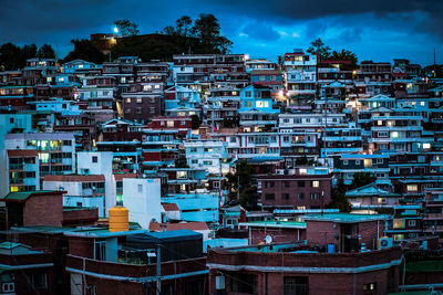 High angle view of illuminated buildings in city against sky