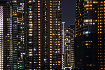 Illuminated buildings in city at night