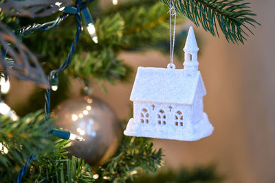 Close-up of christmas decorations hanging on tree