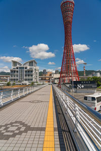 View of bridge and buildings against sky