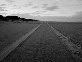 Road amidst landscape against sky