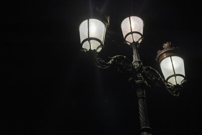 Low angle view of illuminated street light