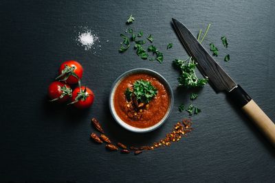 High angle view of fruits on table against black background