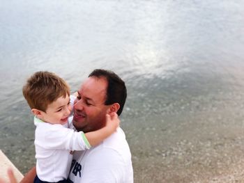 Father and son on shore