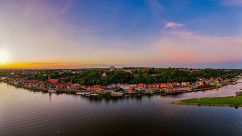Aerial view of river against sky during sunset