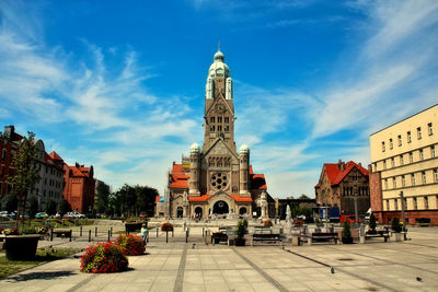 Statue in temple against sky in city