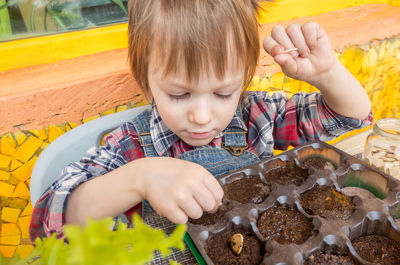 Close-up of boy eating food at home