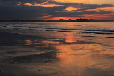 Scenic view of sea against romantic sky at sunset