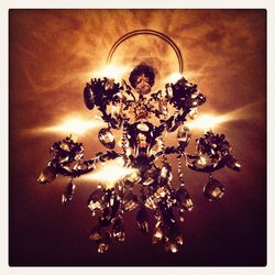 Illuminated light bulbs on wall