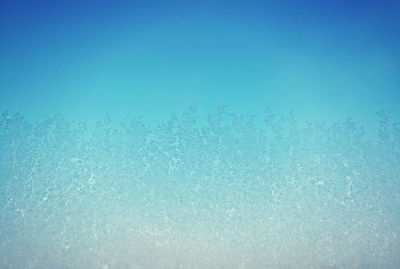 Full frame shot of sea against blue sky