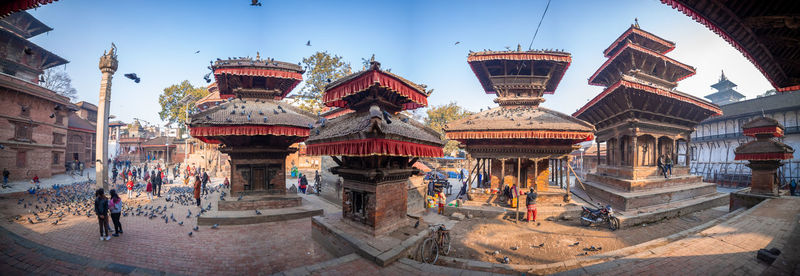 Group of people in temple outside building