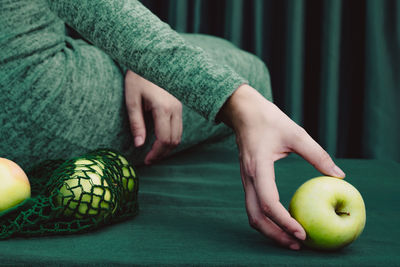 Close-up of hand holding apple