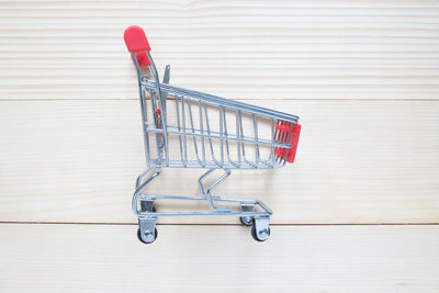 Miniature shopping cart on table