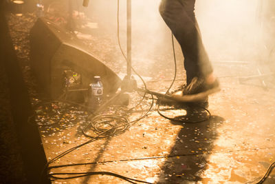 Low section of man standing on floor