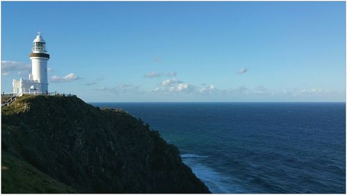 Cape byron lighthouse by sea against sky