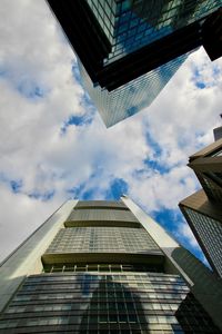 Low angle view of modern buildings against sky