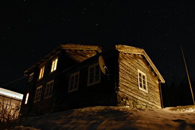 Low angle view of house against sky at night