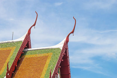 Low angle view of traditional windmill against sky