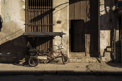 Bicycle parked against wall in building