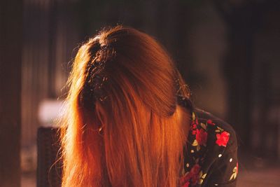 Rear view of woman against blurred background