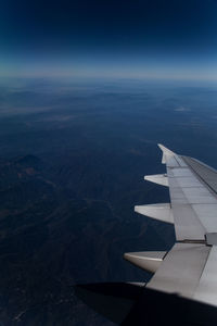 View of airplane wing through window