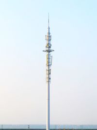 Communications tower against clear sky