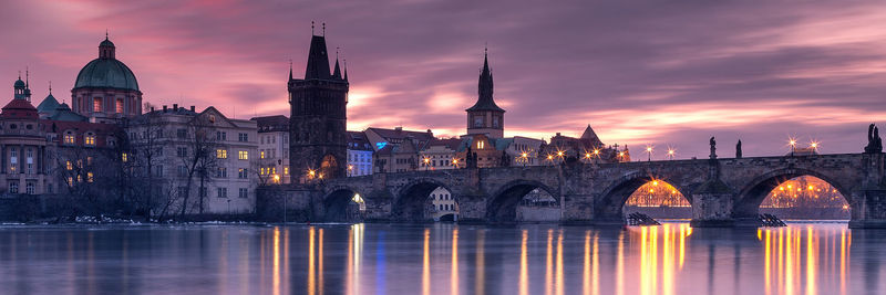 View of bridge over river in city