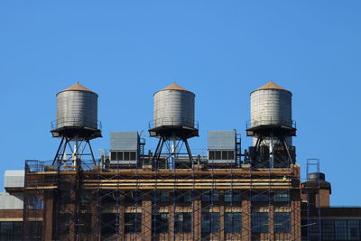 Low angle view of built structure against clear blue sky