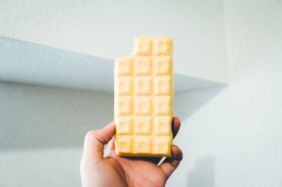 Close-up of hand holding ice cream