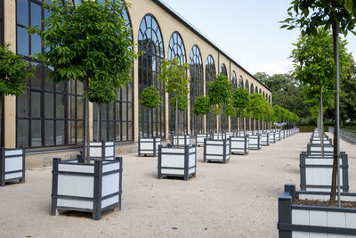 Built structure by trees against clear sky